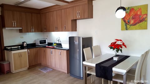 1-Bedroom Apartment at Bonbel Condominium | Private kitchen | Full-size fridge, microwave, stovetop, electric kettle