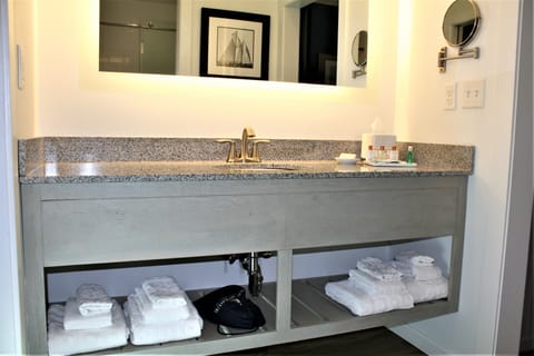 Shore Choice Queen Suite | Bathroom | Designer toiletries, hair dryer, towels