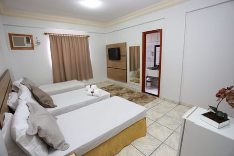 Deluxe Triple Room | Minibar, blackout drapes, free WiFi, bed sheets