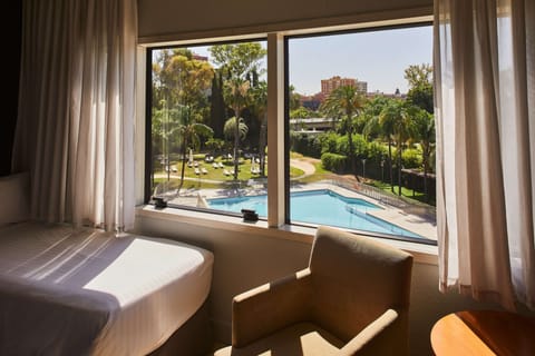 Comfort Double Room, Pool View | Down comforters, minibar, in-room safe, desk