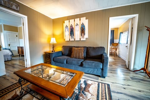 Centennial Cabin, Riverfront Deck, 2 Queen Bedroom, Kitchen | Living area | Flat-screen TV