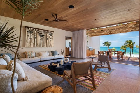 Suite, 2 Bedrooms, Smoking, Oceanfront | Living room | 58-inch flat-screen TV with cable channels, TV, pay movies