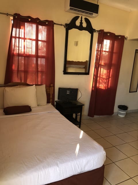 Standard Room | Individually decorated, blackout drapes, iron/ironing board, free WiFi