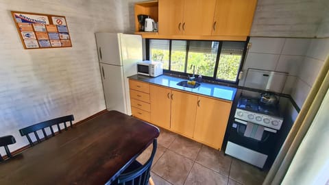 Bungalow, 1 Bedroom | Private kitchen | Full-size fridge, microwave, oven, stovetop