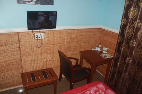 Standard Double Room | Living area | Flat-screen TV