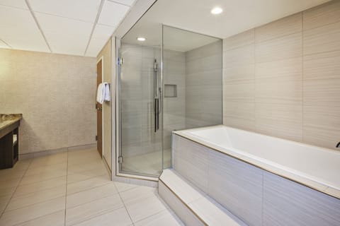 Suite, 1 Bedroom, Jetted Tub | Bathroom | Combined shower/tub, hydromassage showerhead, hair dryer, towels