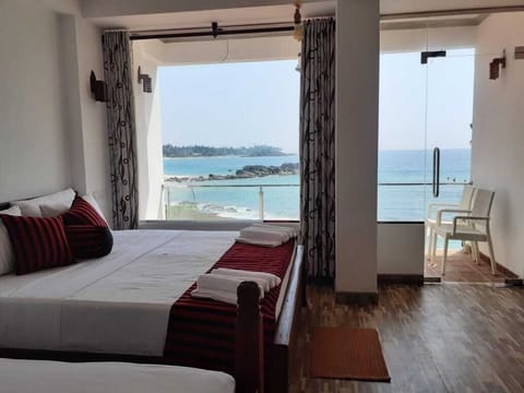 Superior Triple Room, 1 Bedroom, Sea View, Beachfront | Premium bedding, desk, laptop workspace