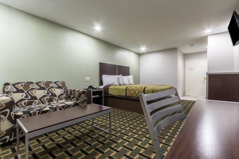 Deluxe Suite, 1 King Bed | Individually furnished, desk, blackout drapes, iron/ironing board