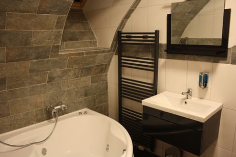 Suite, Non Smoking, Hot Tub | Bathroom | Shower, hair dryer, towels