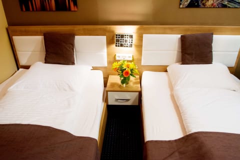 Economy Twin Room, Shared Bathroom (Two Rooms Share One Bathroom) | Minibar, desk, iron/ironing board, free WiFi