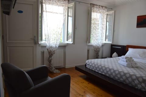 Deluxe Quadruple Room, 2 Bedrooms, Terrace, Garden View (Paola) | Blackout drapes, iron/ironing board, free WiFi, bed sheets