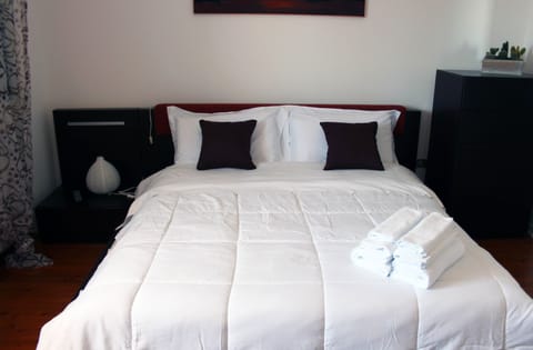 Deluxe Quadruple Room, 2 Bedrooms, Terrace, Garden View (Paola) | Blackout drapes, iron/ironing board, free WiFi, bed sheets