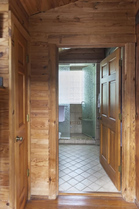 Carolina Log Cabin | Bathroom | Rainfall showerhead, eco-friendly toiletries, hair dryer, bathrobes