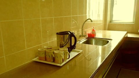 Apartment, 3 Bedrooms | Private kitchenette | Fridge, microwave, coffee/tea maker