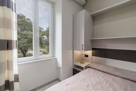 Economy Double Room | 1 bedroom, premium bedding, minibar, in-room safe