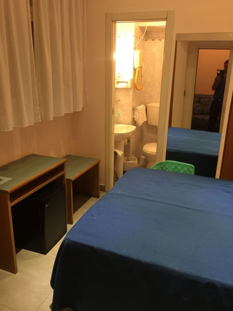 Economy Double Room | 1 bedroom, premium bedding, minibar, in-room safe