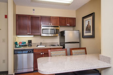 Suite, 1 King Bed | Private kitchen | Fridge, microwave, stovetop, dishwasher