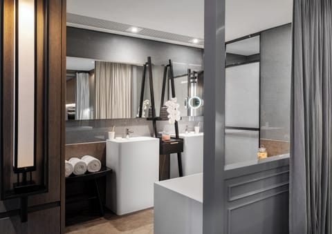 CHAO Suite 80 | Bathroom | Separate tub and shower, rainfall showerhead, designer toiletries