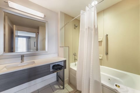 Suite, 1 King Bed, Non Smoking, Jetted Tub (Living Room) | Bathroom | Combined shower/tub, free toiletries, hair dryer, towels