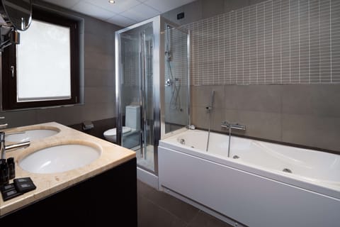 Junior Suite, 1 King Bed (Second and Third bed is a Sofabed) | Bathroom | Combined shower/tub, free toiletries, hair dryer, bidet