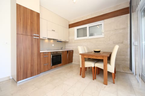 Standard Apartment, 1 Double Bed with Sofa bed, Poolside | Private kitchen | Fridge, microwave, stovetop, dishwasher