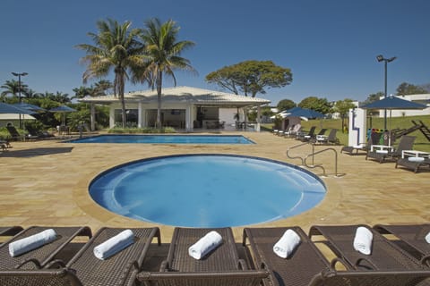 Outdoor pool, pool umbrellas, sun loungers