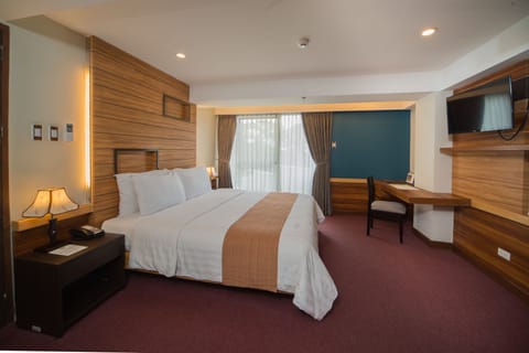 Family Room, Multiple Beds | Premium bedding, minibar, in-room safe, individually furnished
