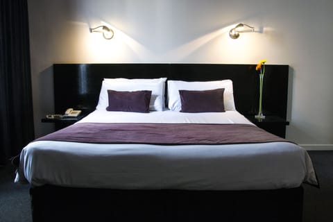 Premium bedding, down comforters, pillowtop beds, minibar