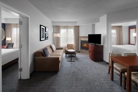 Suite, 2 Bedrooms, Fireplace | Living room | 32-inch flat-screen TV with cable channels, TV, pay movies