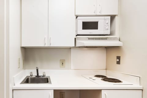 Fridge, microwave, stovetop, dining tables