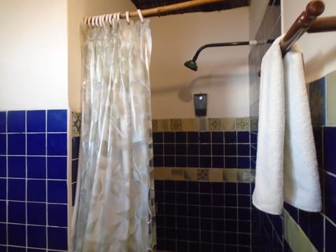 Quadruple Room with Balcony | Bathroom | Shower, designer toiletries, towels, soap