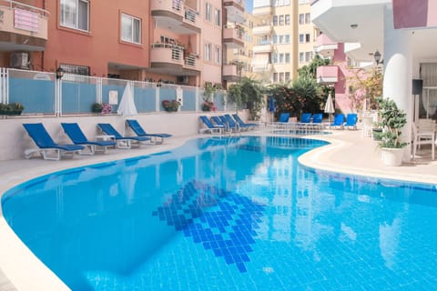 Outdoor pool, open 8:30 AM to 7:30 PM, pool umbrellas, sun loungers