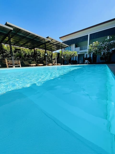 Outdoor pool, pool umbrellas, sun loungers