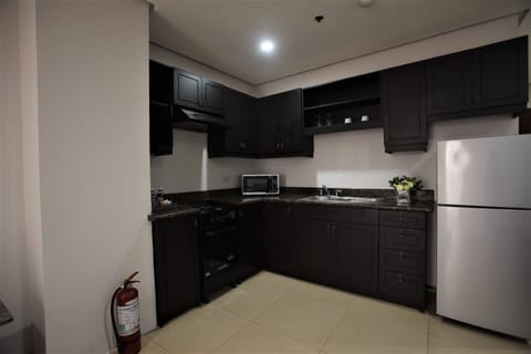 Premier Suite, 1 Bedroom | Private kitchen | Fridge, microwave, stovetop, coffee/tea maker