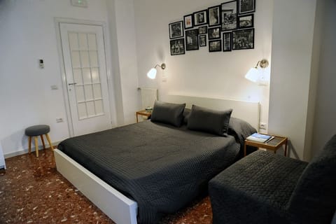 Economy Double Room | 1 bedroom, minibar, desk, blackout drapes