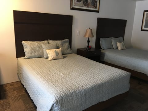 Standard Room, 2 Queen Beds | Individually furnished, desk, free WiFi, bed sheets