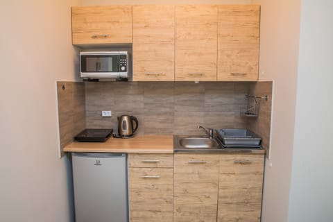 Apartment, 1 Bedroom | Private kitchenette | Fridge, microwave, coffee/tea maker, electric kettle