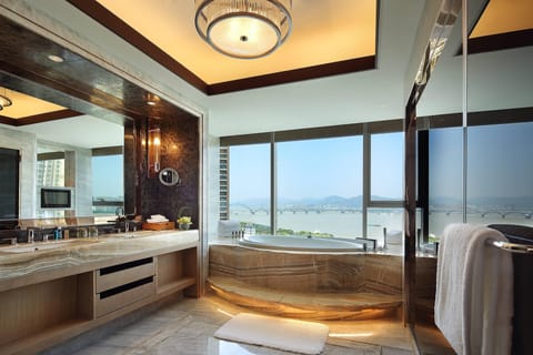 Separate tub and shower, rainfall showerhead, hair dryer, bathrobes