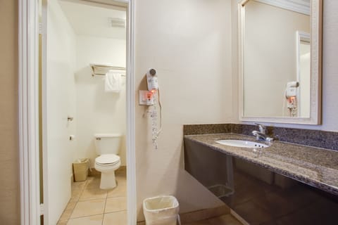 Standard Room, 2 Queen Beds | Bathroom | Combined shower/tub, free toiletries, hair dryer, towels