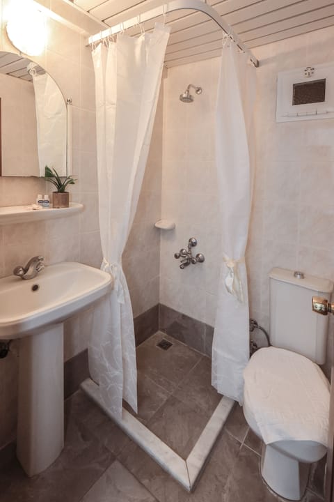 Apartment, 1 Bedroom | Bathroom | Shower, free toiletries, hair dryer, towels