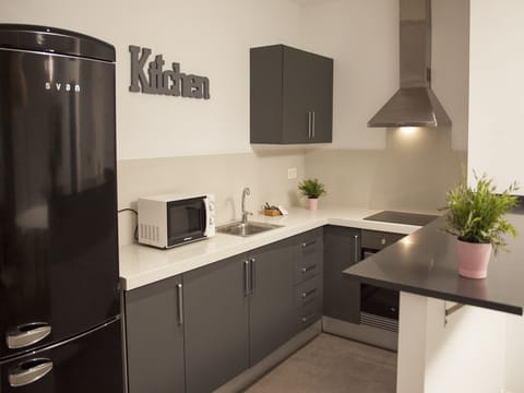 Apartment, 3 Bedrooms, Balcony | Private kitchen | Full-size fridge, microwave, oven, stovetop