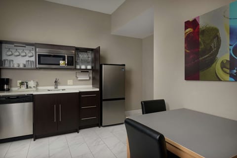 Suite, 1 King Bed, Non Smoking | Private kitchen | Full-size fridge, microwave, dishwasher, cookware/dishes/utensils