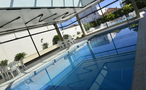 Indoor pool, outdoor pool, open 6 AM to 10 PM, sun loungers