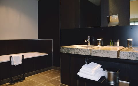 Suite, 1 King Bed | Bathroom | Separate tub and shower, designer toiletries, hair dryer, bathrobes