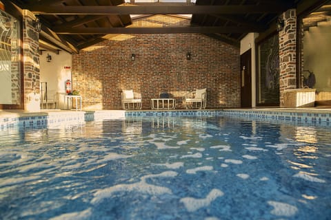 Indoor pool, pool umbrellas, sun loungers