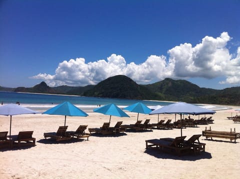 Beach nearby, white sand, sun loungers, beach umbrellas