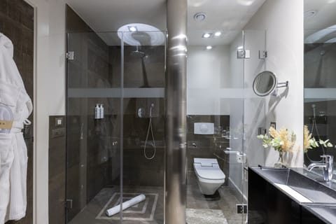 Separate tub and shower, rainfall showerhead, designer toiletries