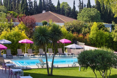 Seasonal outdoor pool, open 9:00 AM to 9:00 PM, pool umbrellas