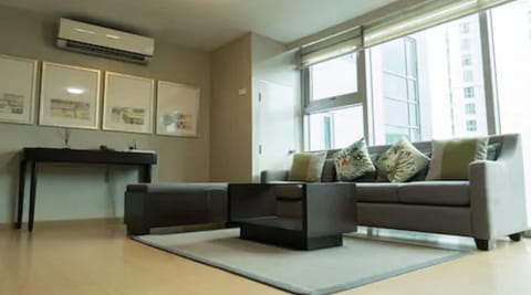 Premier One Bedroom Suite | Living room | Flat-screen TV