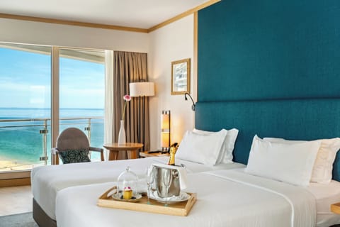 Deluxe Room, Ocean View | Minibar, in-room safe, desk, blackout drapes